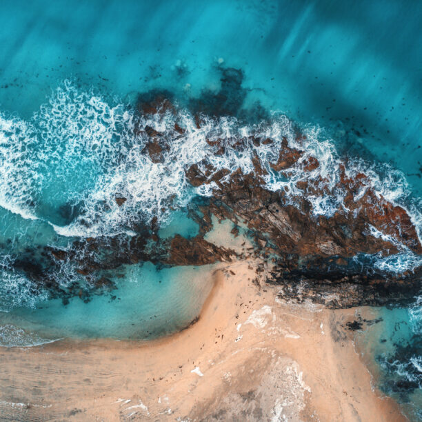 Aerial view of waves rocks and transparent sea 2022 02 01 23 42 08 utc